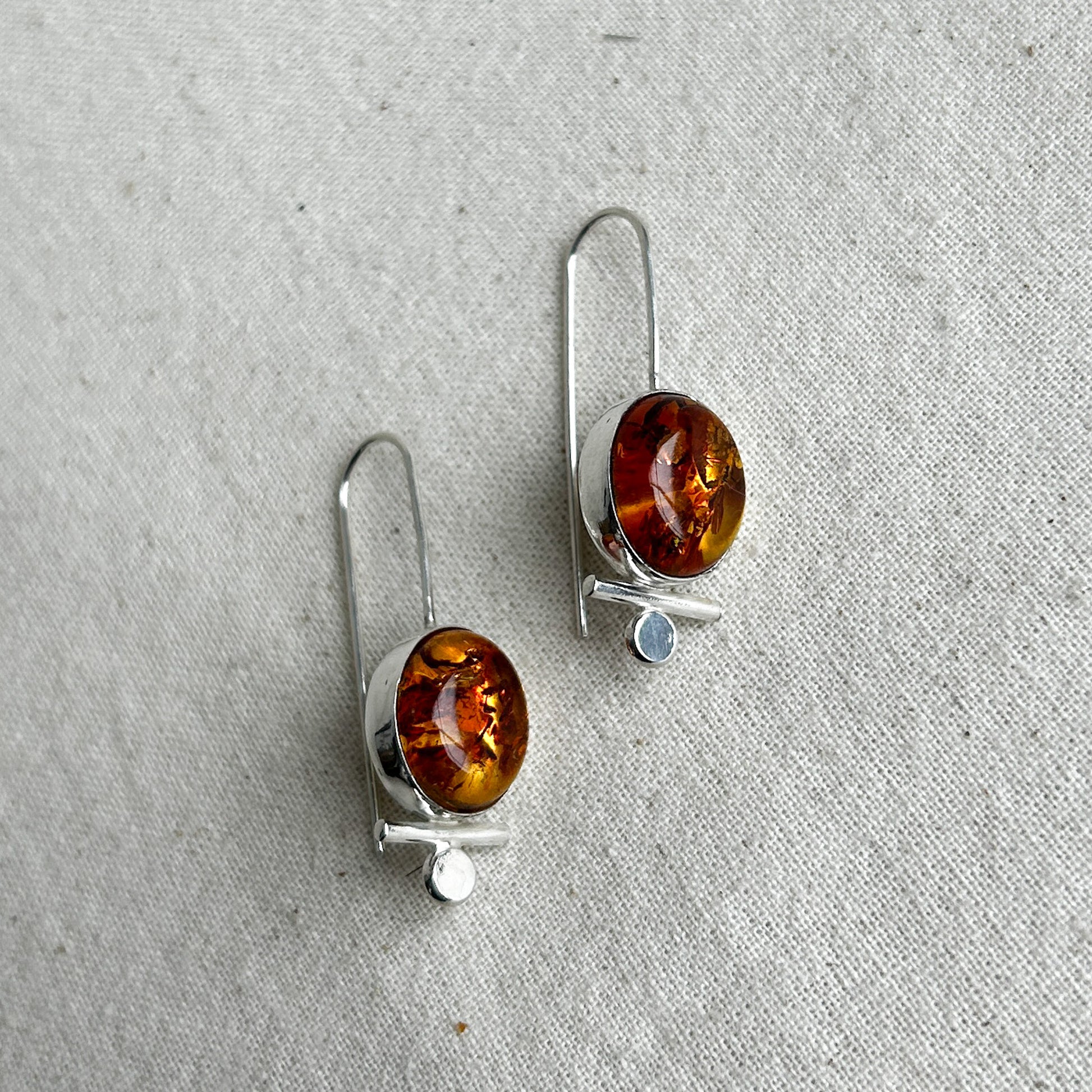 Amber dangle earrings in silver