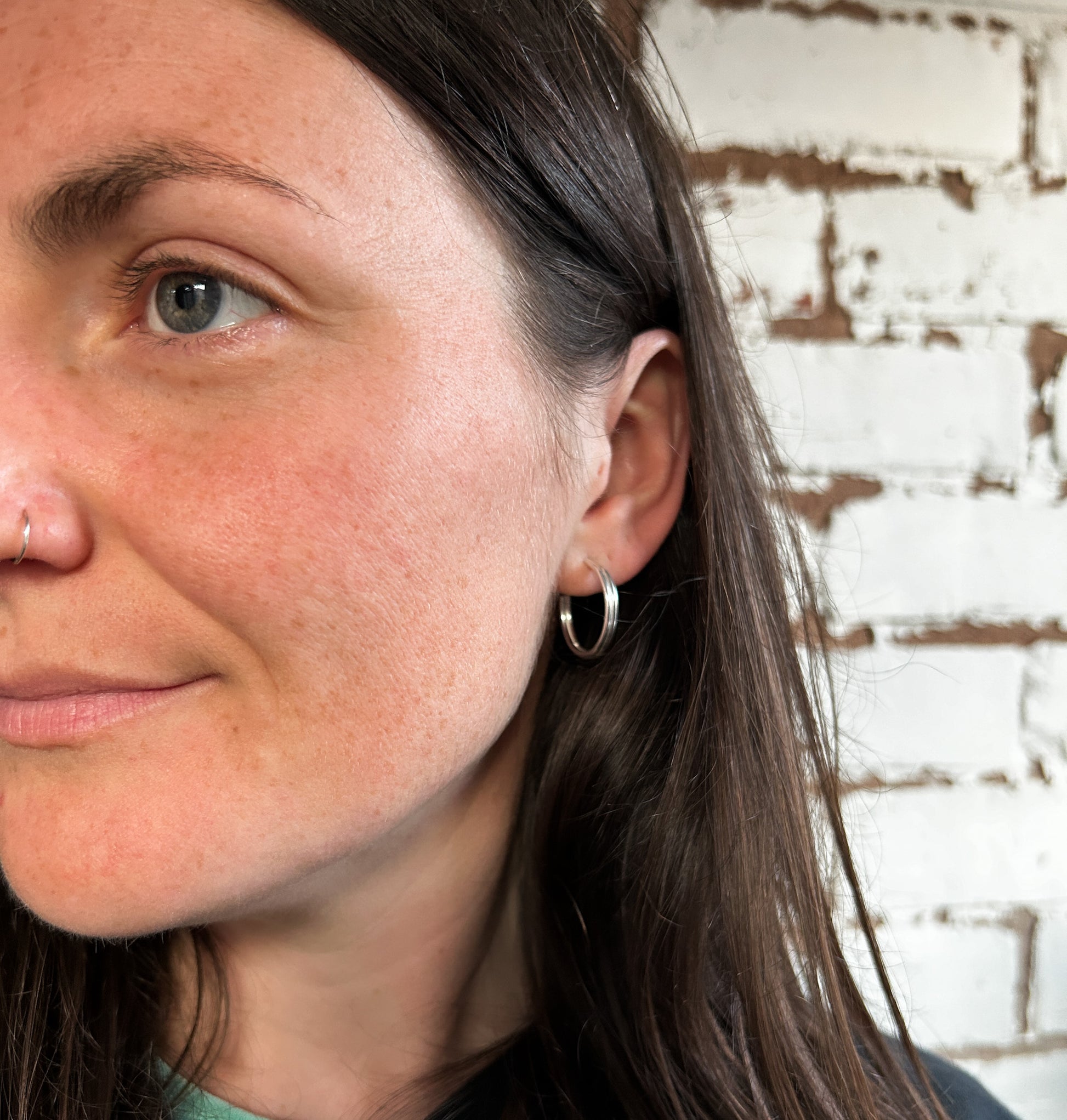 Model wearing Argentium silver ear huggies