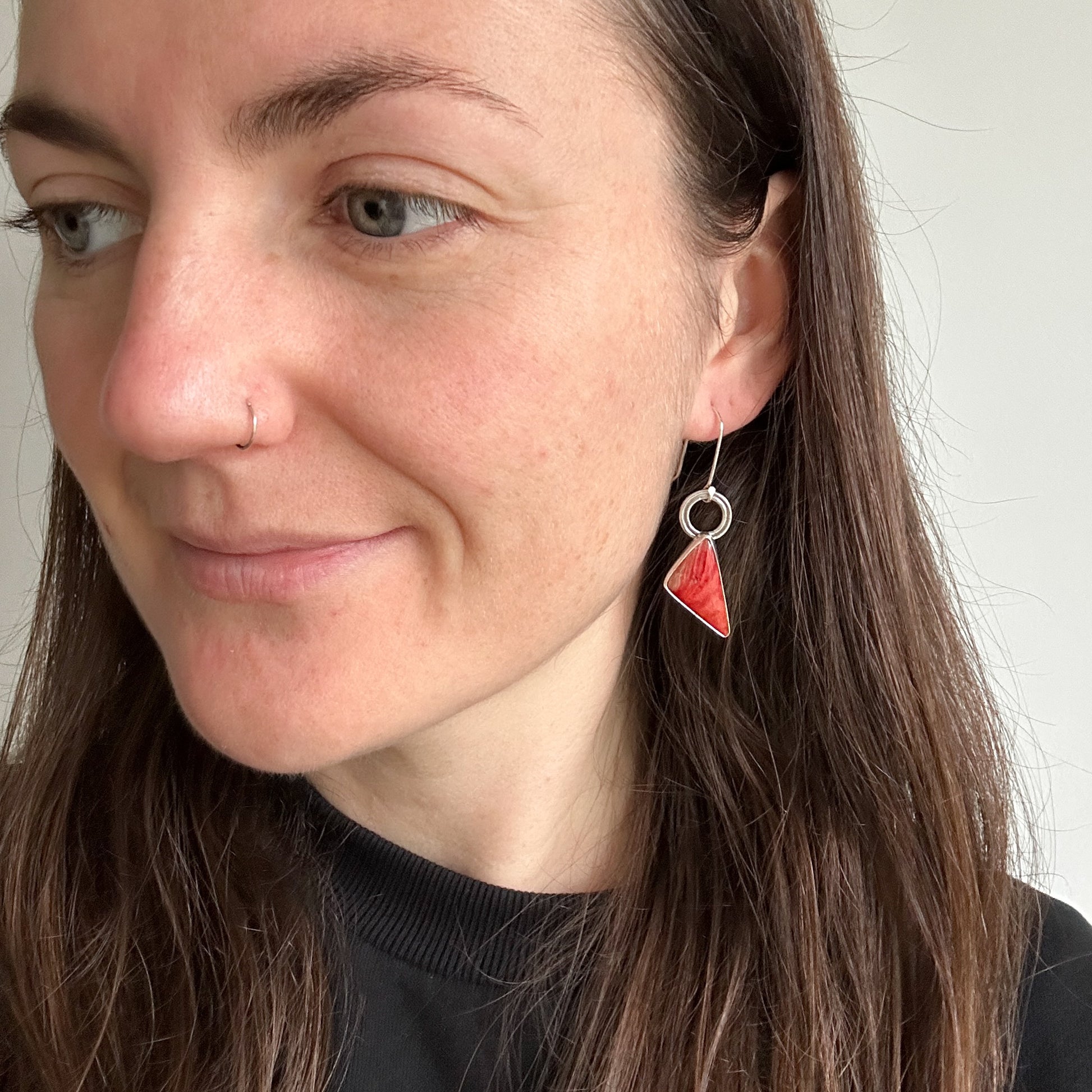 Model wearing red Mookaite Jasper earrings