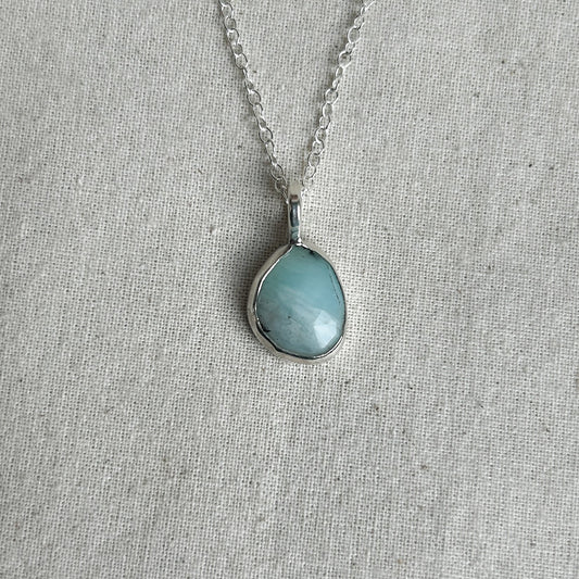 Small blue pendant with silver setting