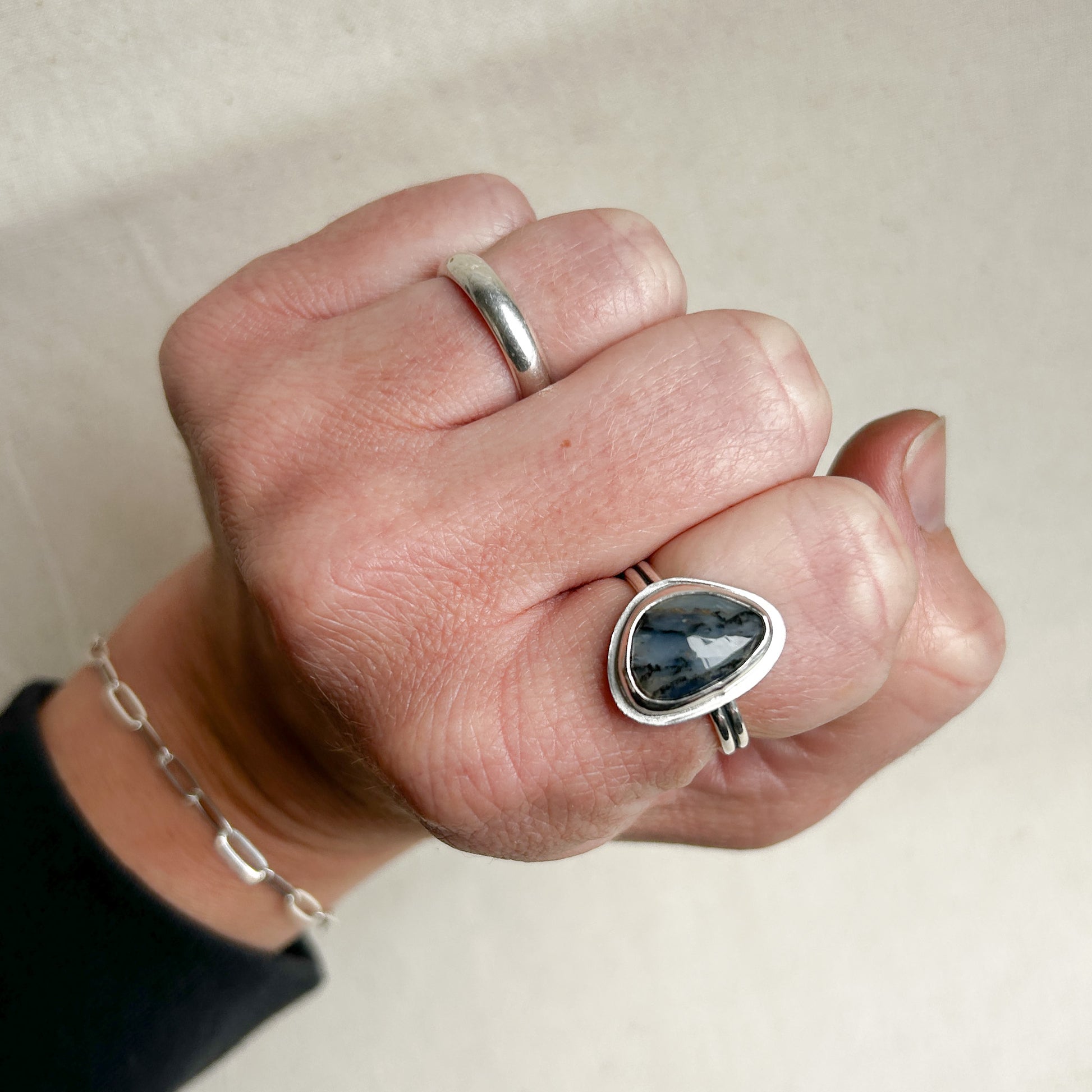 Opal ring modeled on index finger