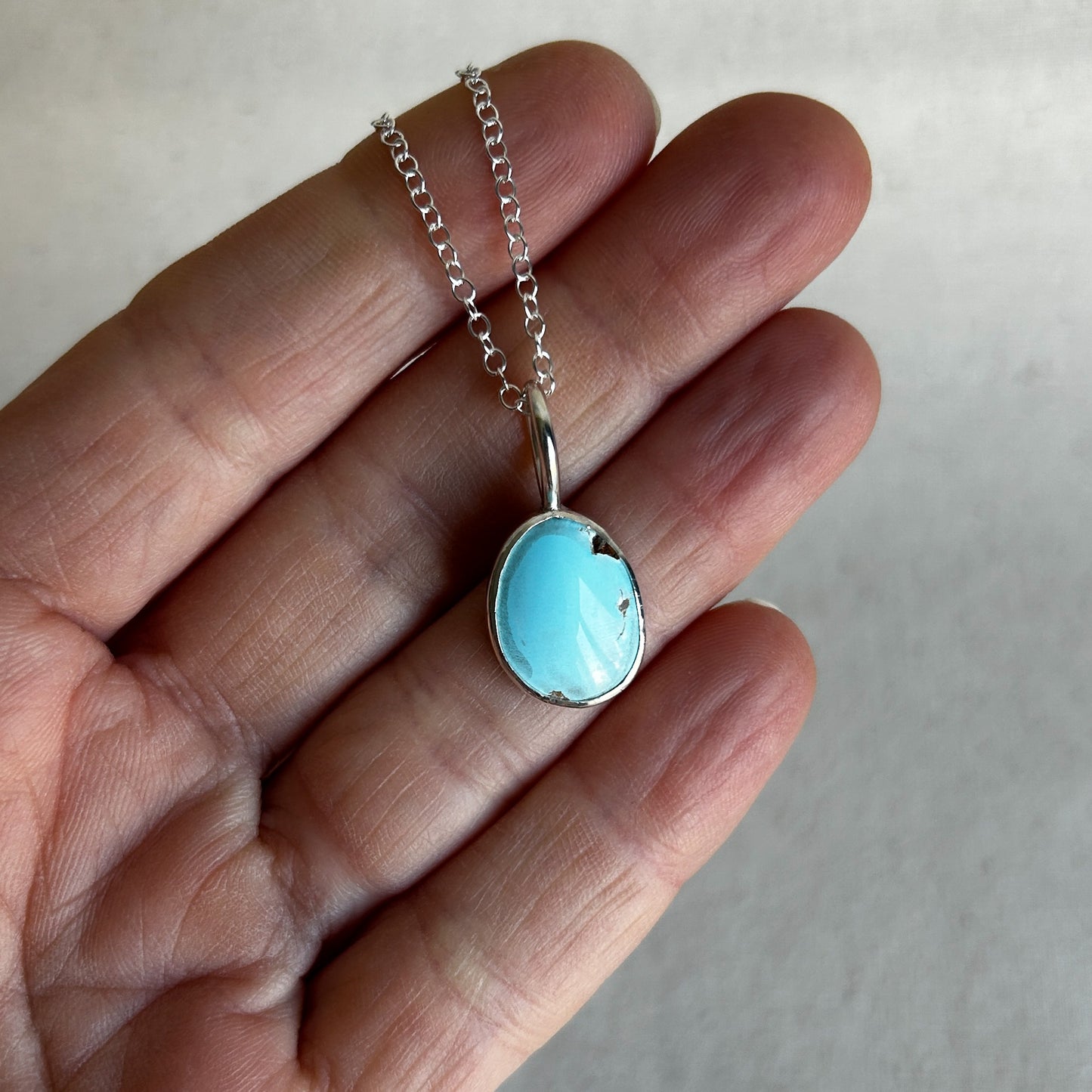 Baby blue turquoise pendant set in Argentium silver with minimalist loop bail