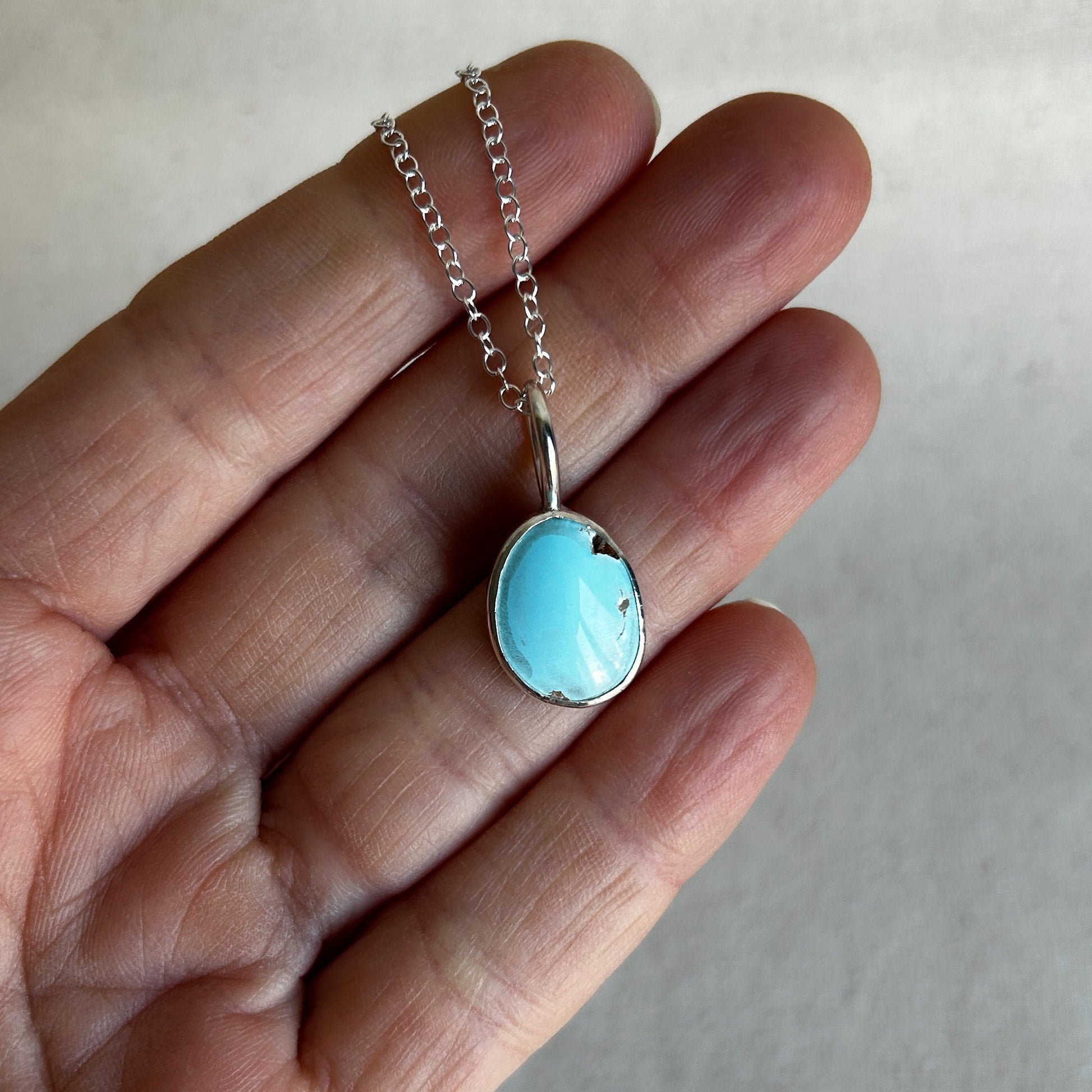 Baby blue turquoise pendant set in Argentium silver with minimalist loop bail