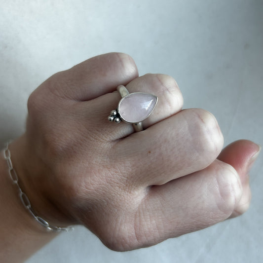 Silver rose quartz ring on model's hand