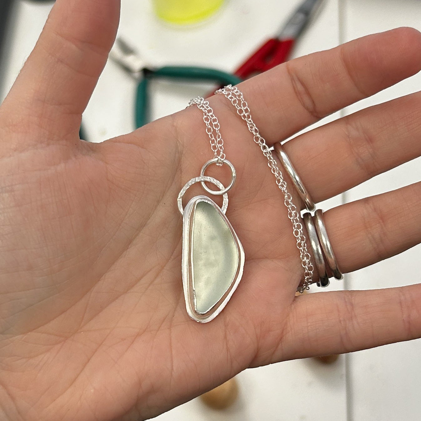 Handmade Seaglass pendant in palm of hand