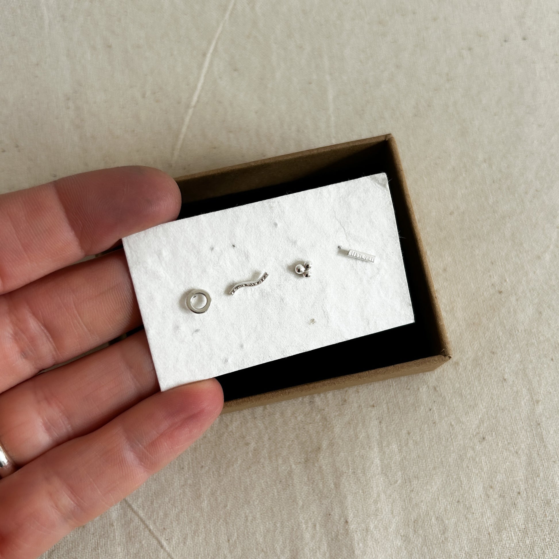 Set of four silver studs in gift box