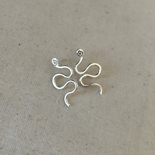 High-polish silver stud earrings shaped like snakes