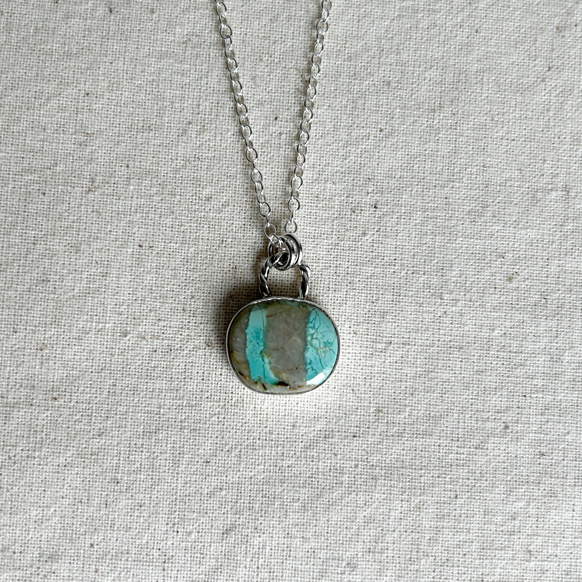 Aqua and grey striped turquoise  pendant with a twisted rope-style bail