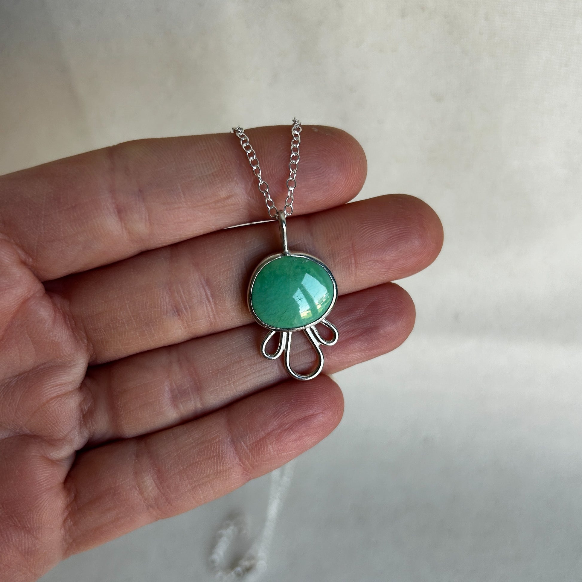 Turquoise necklace with silver border and chain