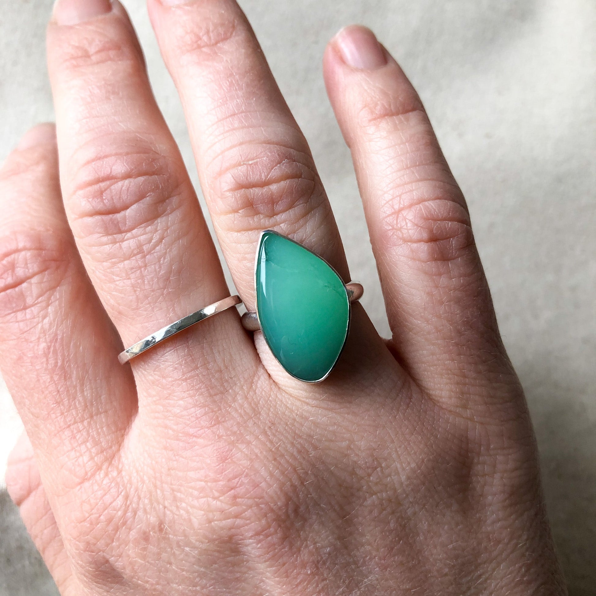 Model wearing Chrysoprase statement ring in recycled sterling silver