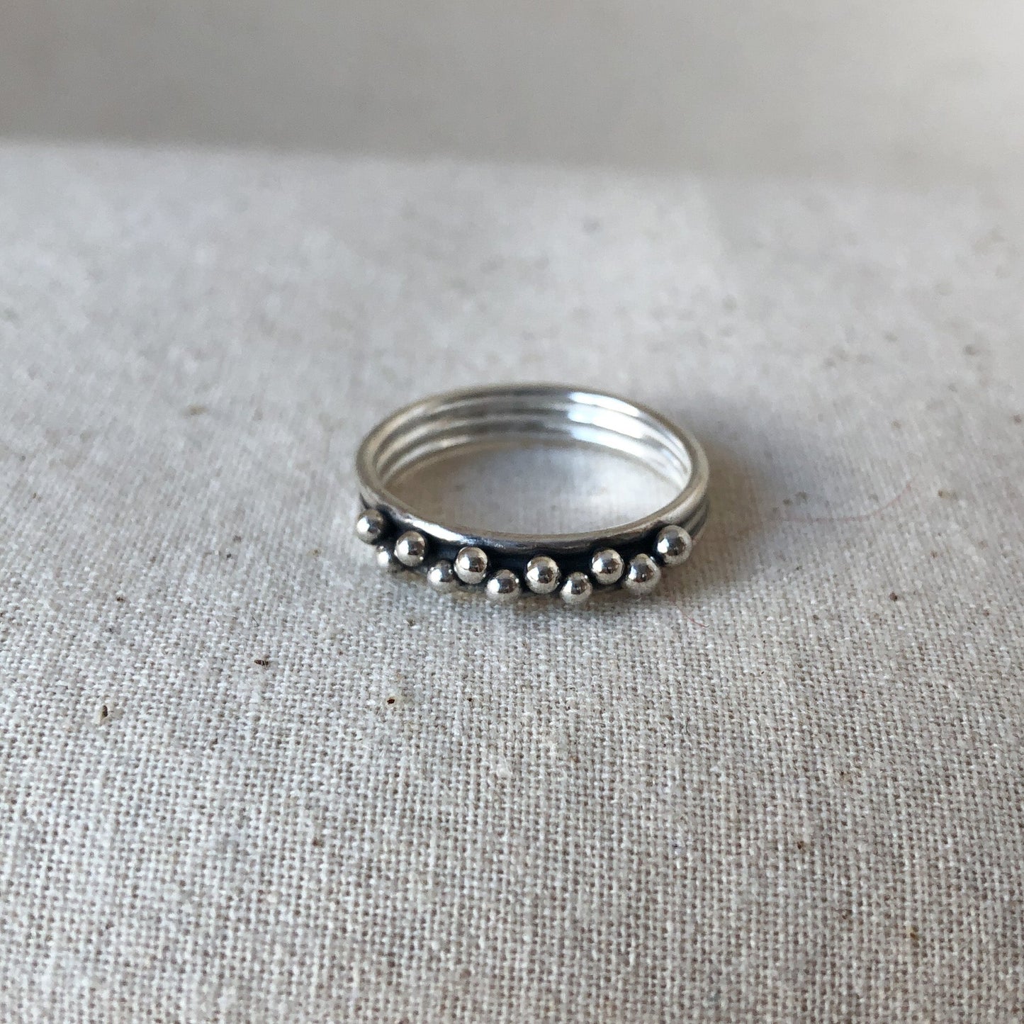 Triple band ring on grey background