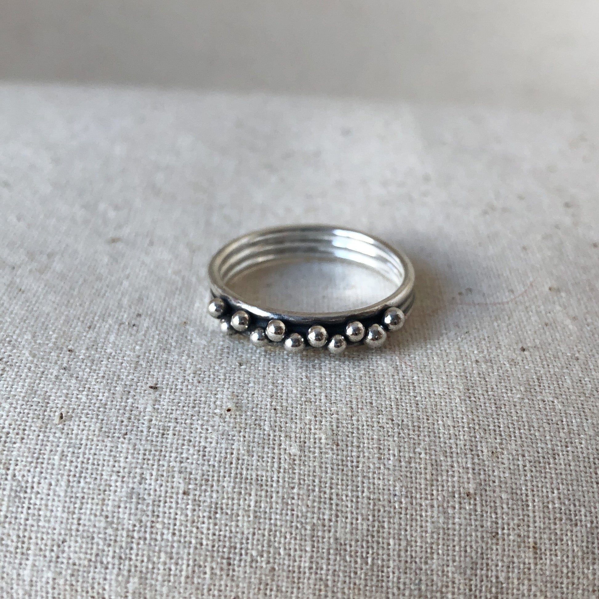 Triple band ring on grey background