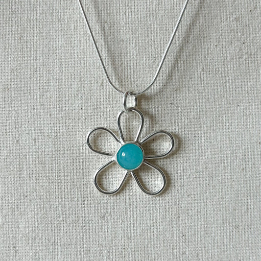 Silver necklace with blue Centre stone.