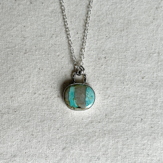 Turquoise and grey striped gemstone pendant with a twisted rope-style bail