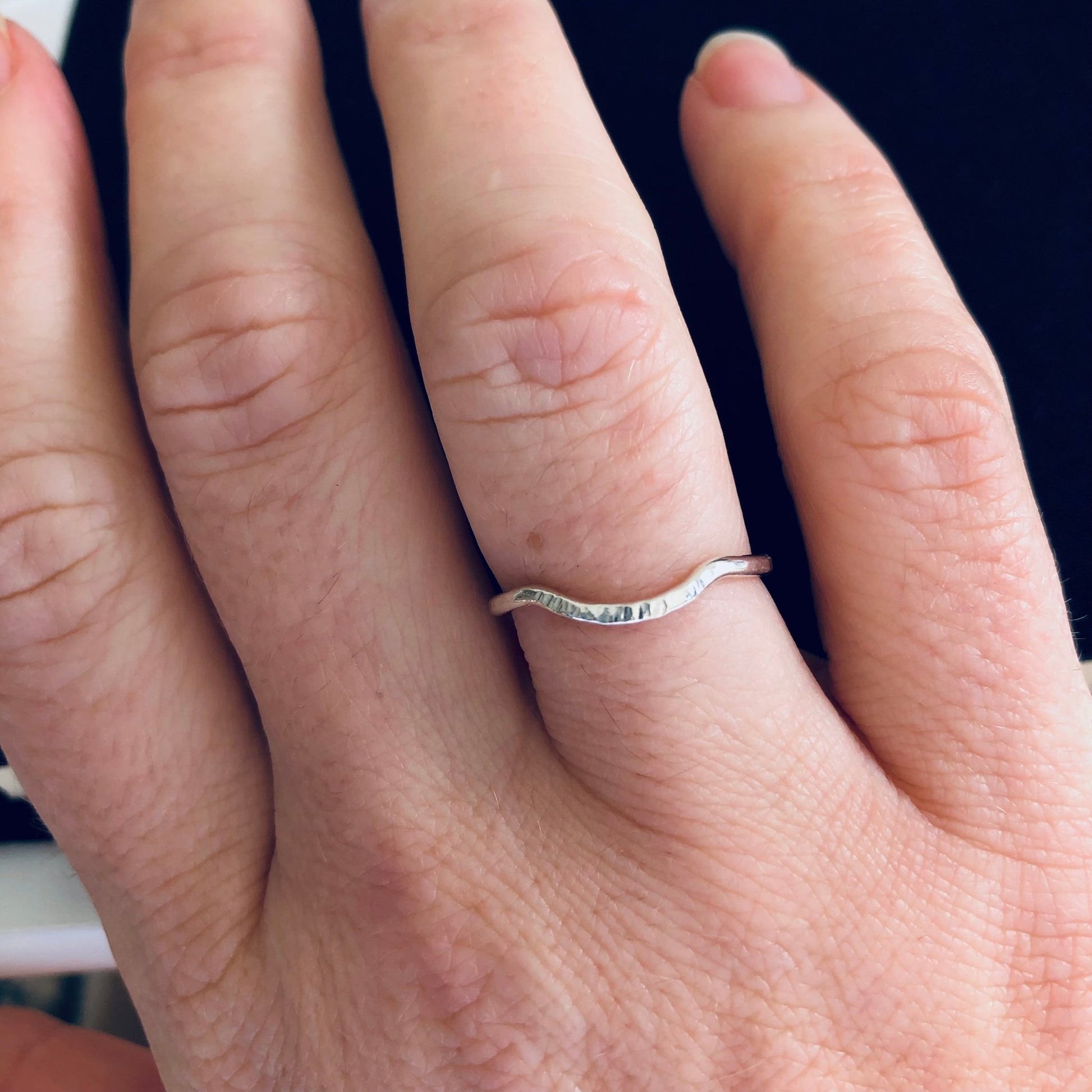 Model wearing silver stacking ring 