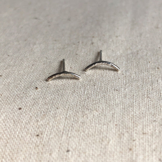 Shimmer sterling silver bar stud earrings on grey background. 